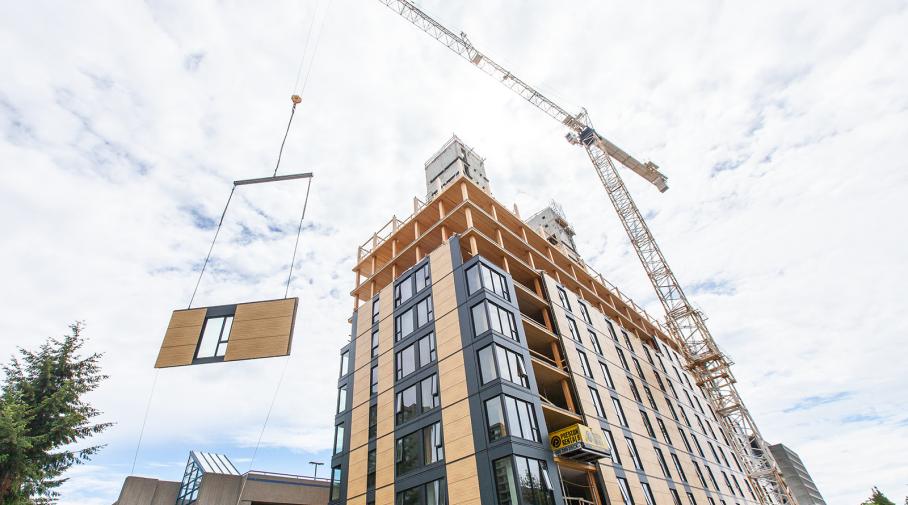 The onsite crew installed one floor of prefabricated envelope panels per day.