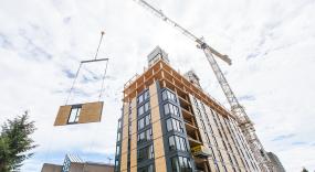The onsite crew installed one floor of prefabricated envelope panels per day.